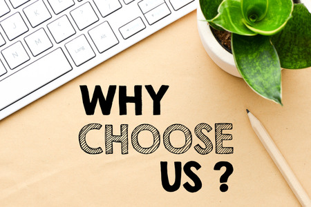 Keyboard and plant with a "why choose us?" graphic